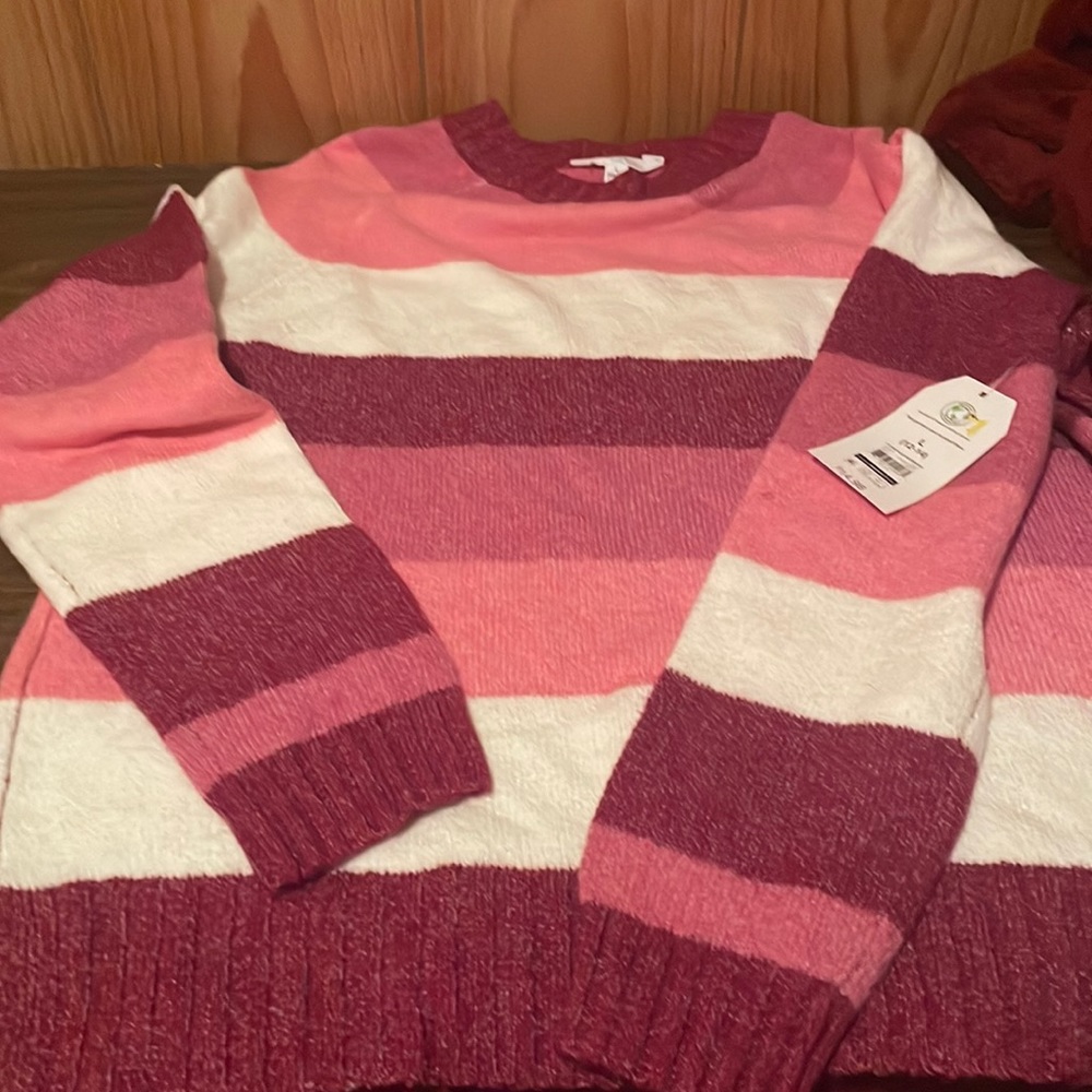 Large pink and white large sweater.